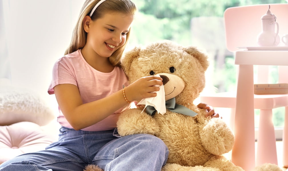 Girl holding a teddy bear